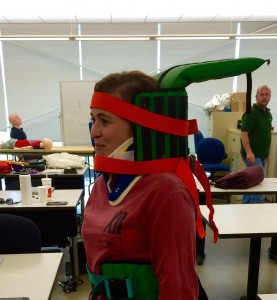 Amanda Mawrence practicing spinal immobilization for her Emergency Medical Technician course.